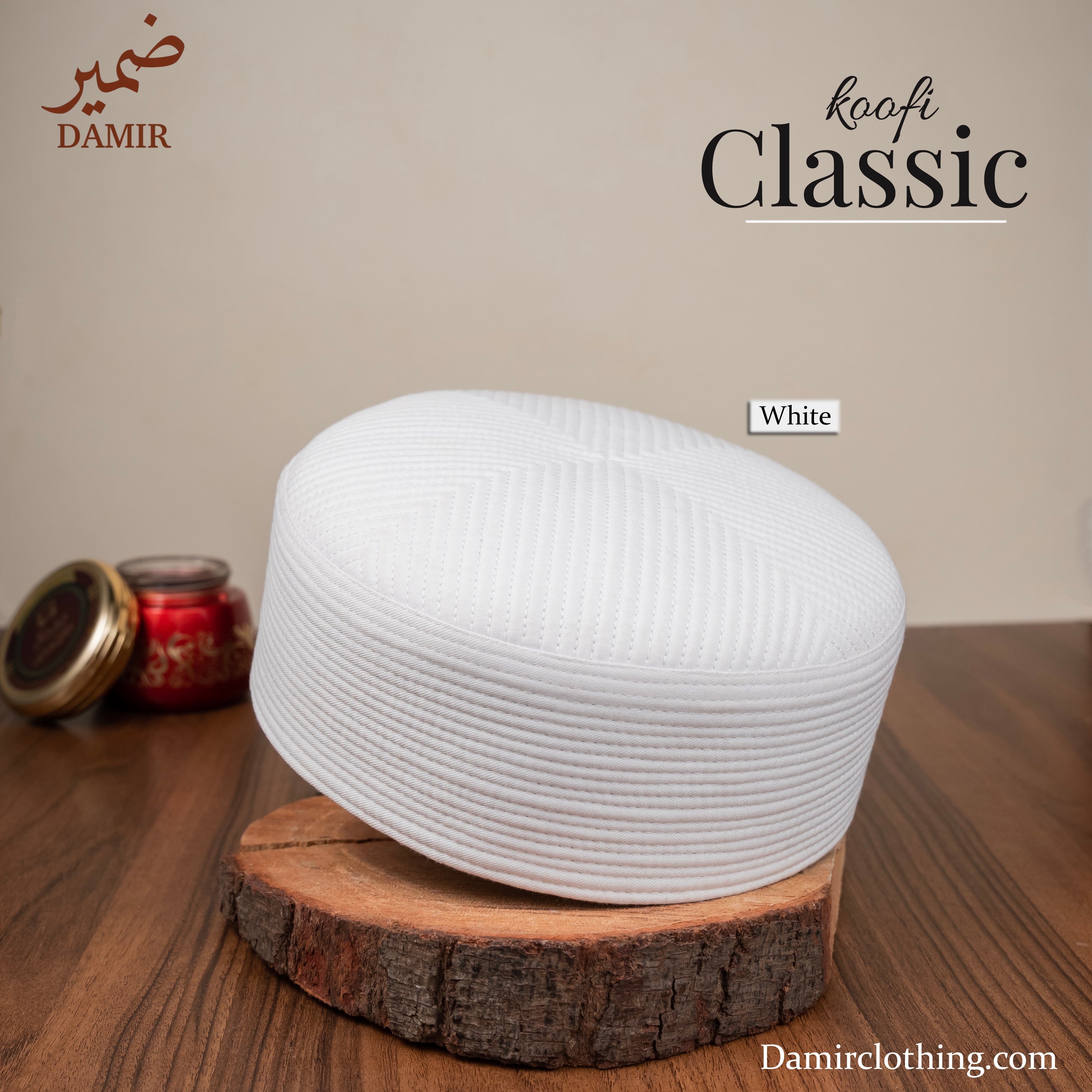 White knitted cap on a wooden stand with 'DAMIR' branding and 'koofi Classic' text.