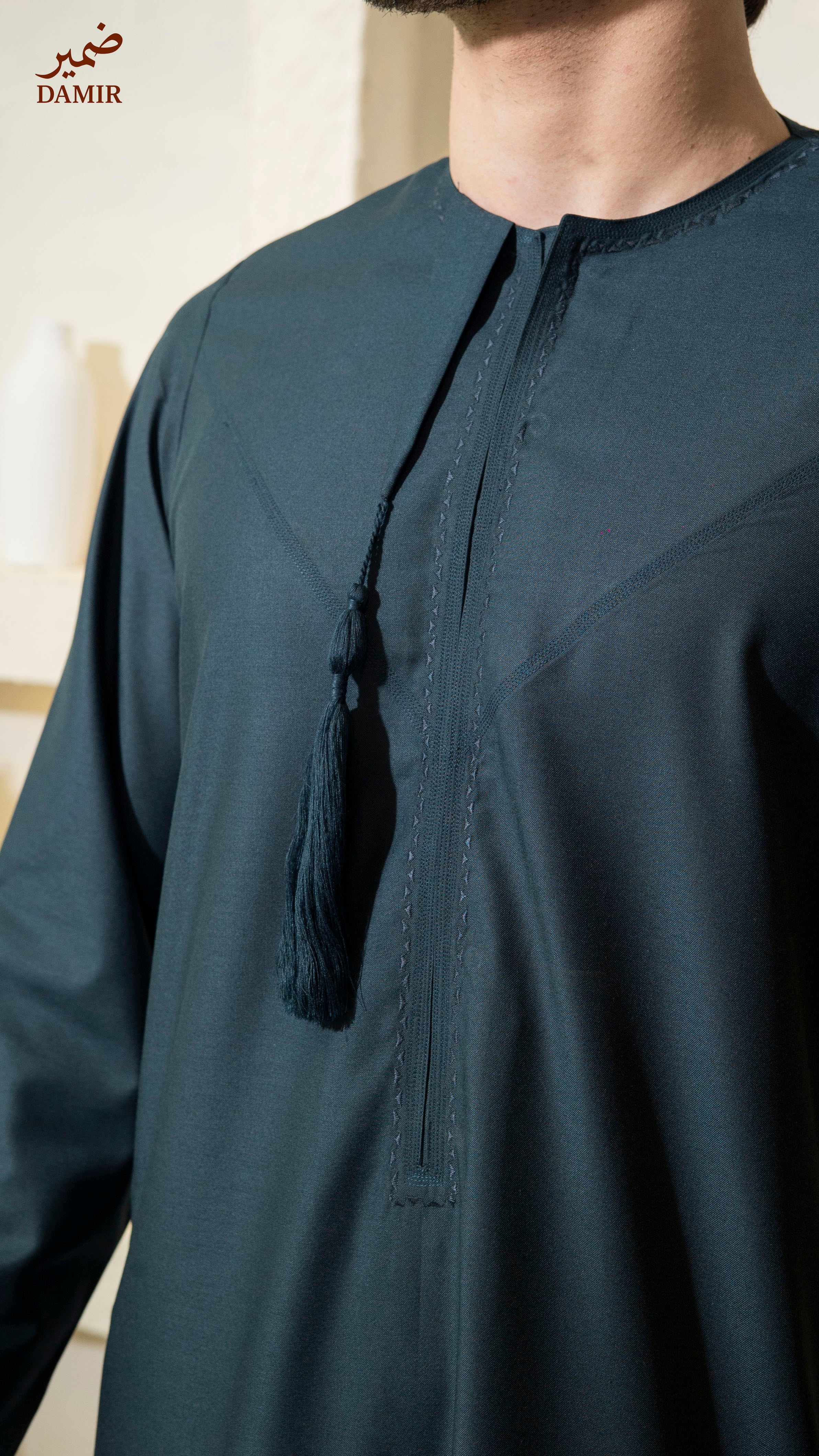 Teal Sapphire traditional outfit with tassel detail, brand 'DAMIR' visible.